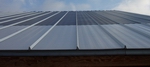 Flexible solar panel roofing system